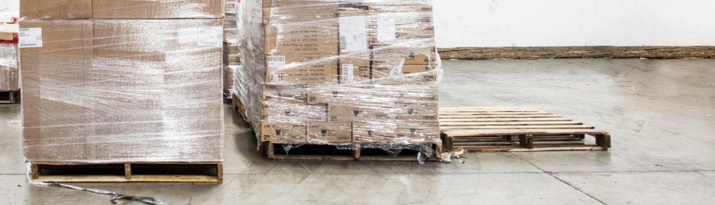 plastic wrapped boxes in warehouse