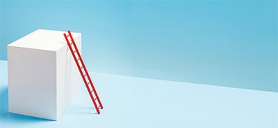 Red ladder on white box