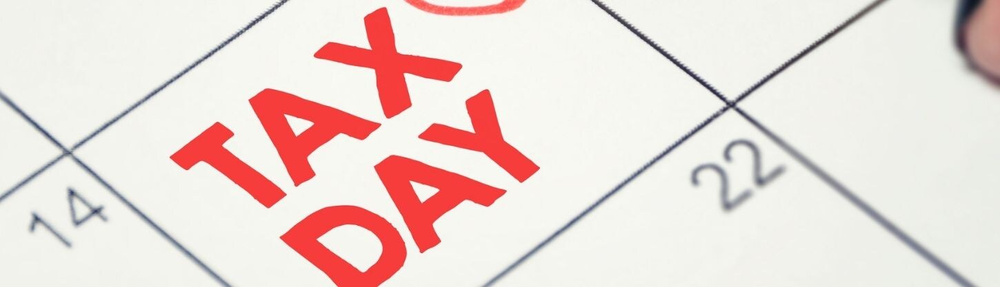 Calendar pictured with the 15th circled saying, "tax day."